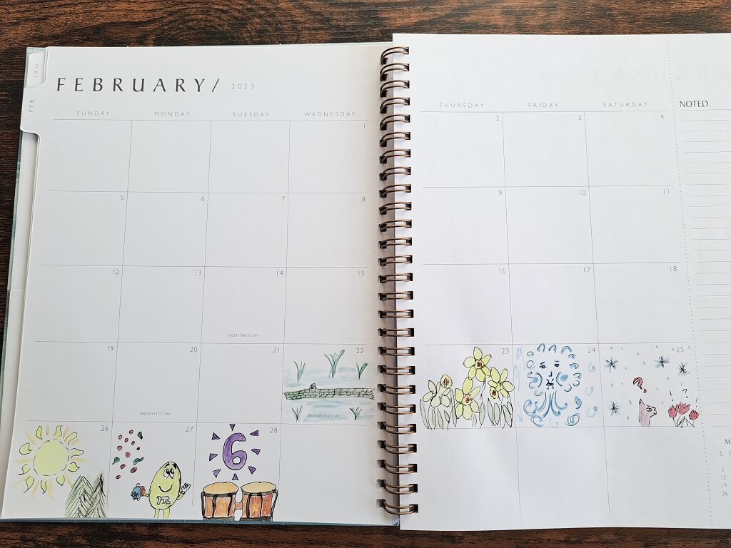 Calendar opened to the month of February 2023 with small paintings for each day.